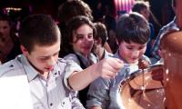 The boys are definately keen on the hired chocolate fountain at a Melbourne birthday party.