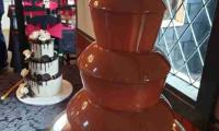 Waiting for the guests to arrive and enjoy the chocolate fountain which compliments the setting at this wedding.